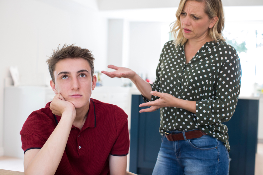 boy being told off by his mum
