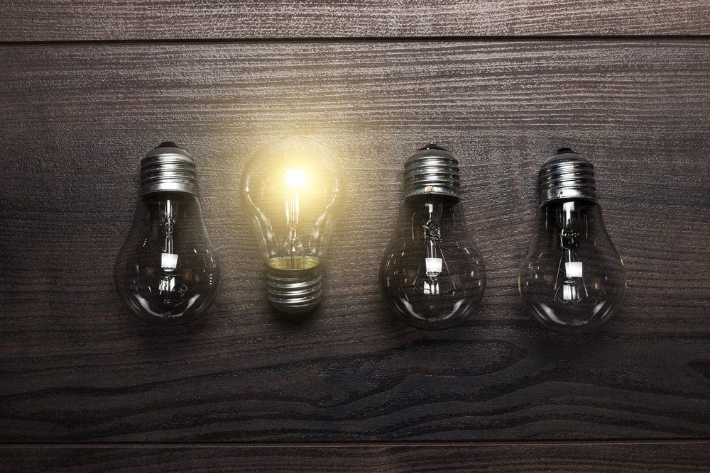 Light bulbs with one up a different way with it on symbolising the importance of difference