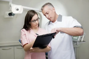 Image showing a principal dentist delegating to their practice manager